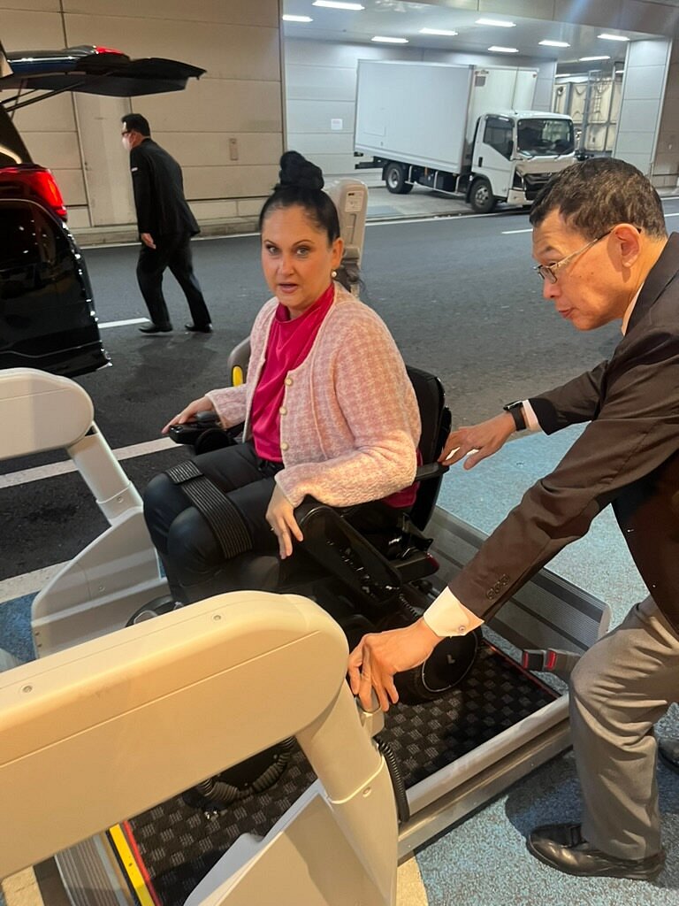 A customer assisted with onboarding using the lift