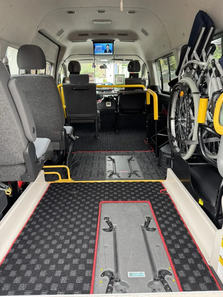 A spacious interior featuring a wheelchair-accessible area and seating for four people who can walk